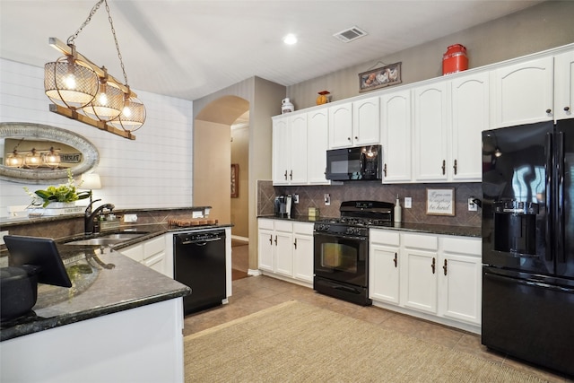 kitchen with black appliances, pendant lighting, light tile patterned floors, and white cabinets