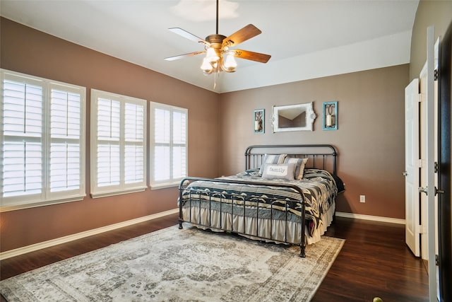 bedroom with dark wood-type flooring and ceiling fan