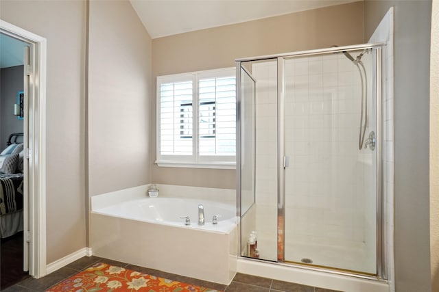 bathroom with tile patterned floors and independent shower and bath