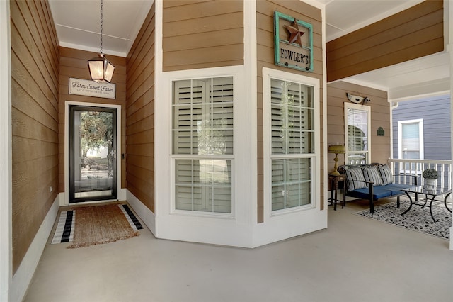 doorway to property featuring a porch