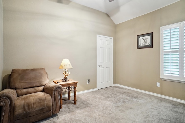 sitting room featuring light colored carpet, plenty of natural light, and vaulted ceiling