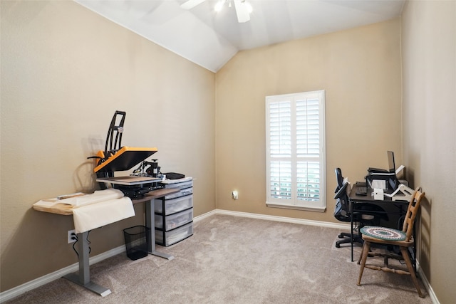 carpeted office with ceiling fan and vaulted ceiling