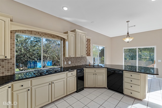 kitchen with backsplash, sink, black appliances, and kitchen peninsula