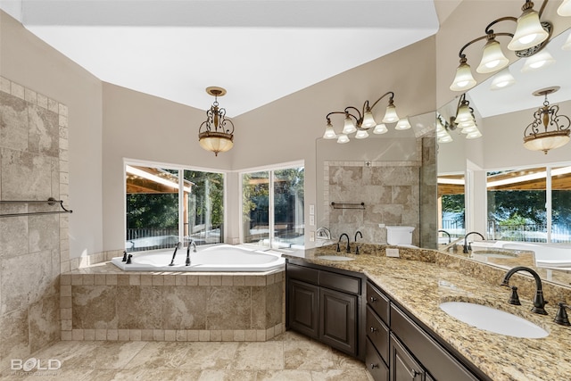 bathroom with vanity, tile patterned floors, and tiled tub