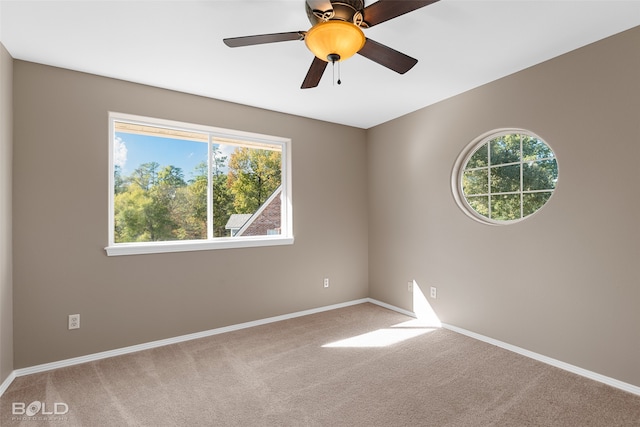 carpeted empty room with ceiling fan