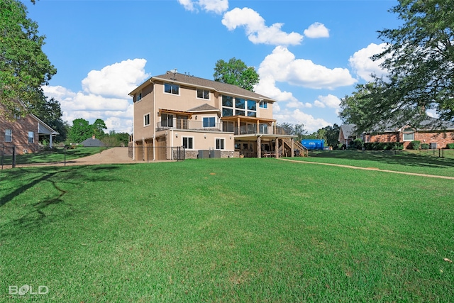 rear view of house with a lawn