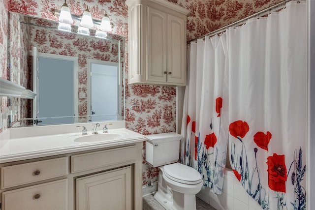 full bathroom with toilet, vanity, and shower / bath combo with shower curtain