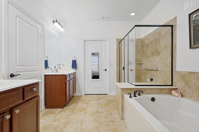 bathroom with vanity, shower with separate bathtub, and tile patterned floors