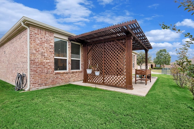 back of house featuring a patio, a pergola, and a yard