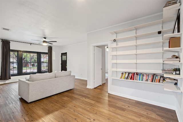 living room with hardwood / wood-style floors and ceiling fan