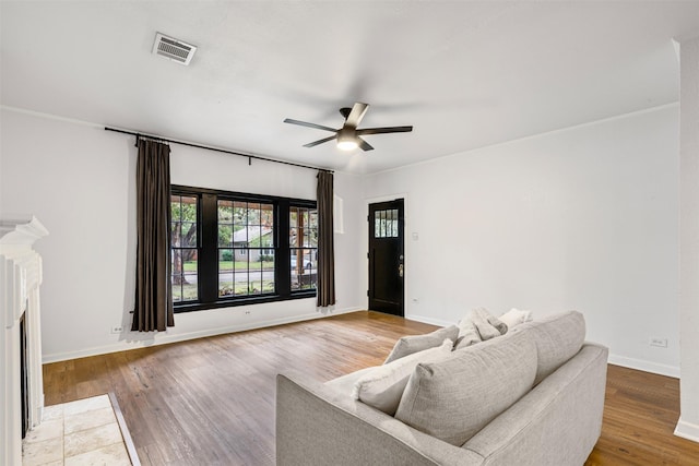 living room featuring ceiling fan and hardwood / wood-style floors