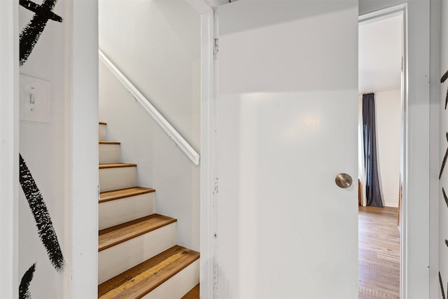 stairway featuring hardwood / wood-style flooring