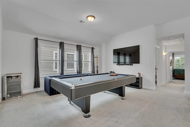 rec room with billiards, vaulted ceiling, light colored carpet, and heating unit