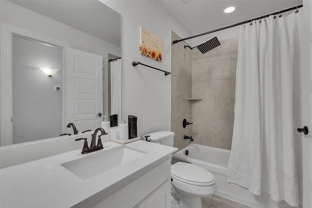 full bathroom featuring vanity, toilet, tile patterned flooring, and shower / bath combo