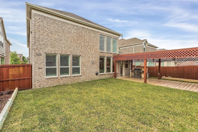 back of house featuring a yard