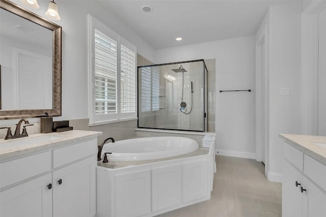 bathroom featuring tile patterned flooring, vanity, and independent shower and bath