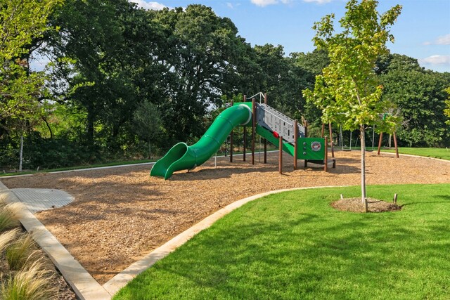 view of play area featuring a lawn