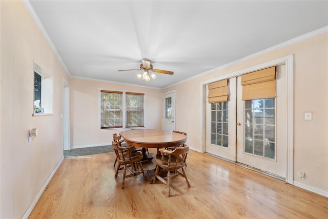 dining area with ornamental molding, french doors, light hardwood / wood-style flooring, and ceiling fan