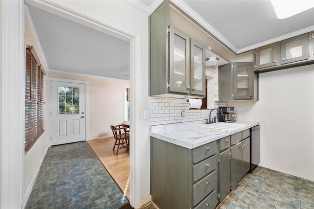 kitchen featuring crown molding, backsplash, gray cabinets, sink, and stainless steel dishwasher