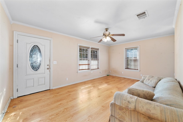 entryway featuring light hardwood / wood-style floors, ceiling fan, and ornamental molding