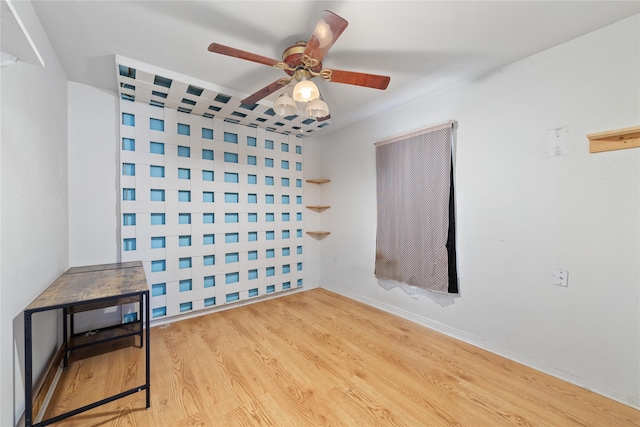 spare room featuring ceiling fan and light hardwood / wood-style floors