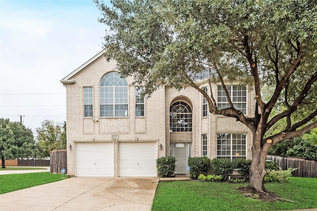 view of front of house with a garage and a front yard