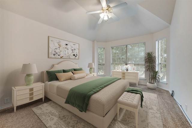 carpeted bedroom featuring vaulted ceiling and ceiling fan