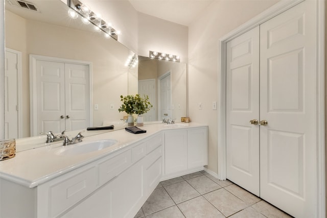 bathroom with vanity and tile patterned flooring