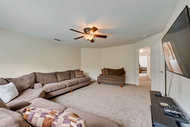 living room featuring carpet flooring and ceiling fan