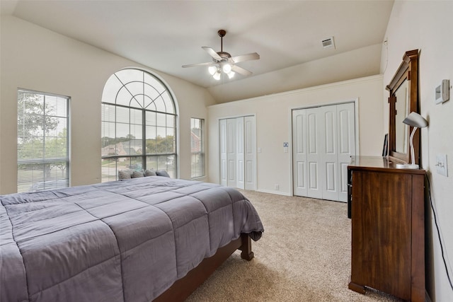 6002 Baldcypress Ct, Garland, TX 75043 - carpeted bedroom with vaulted ceiling, multiple closets, and ceiling fan