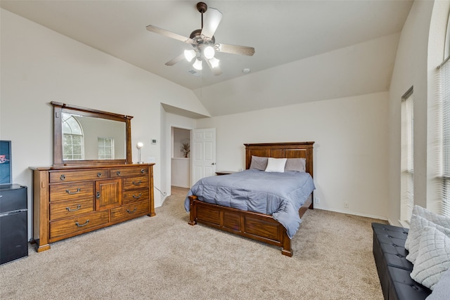 carpeted bedroom featuring ceiling fan and vaulted ceiling