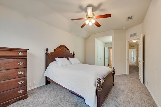 carpeted bedroom featuring ceiling fan and vaulted ceiling