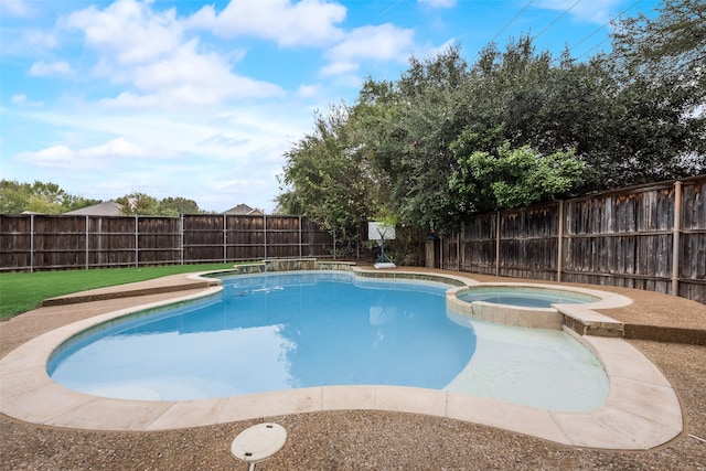 view of pool with an in ground hot tub