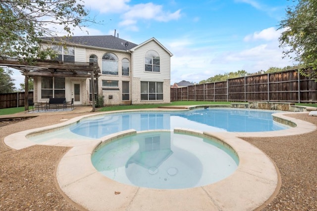 view of pool featuring an in ground hot tub and a patio area