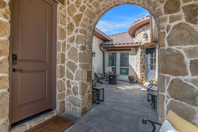 property entrance featuring a patio