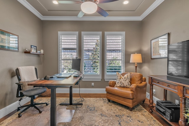 office space featuring a wealth of natural light, hardwood / wood-style flooring, and crown molding