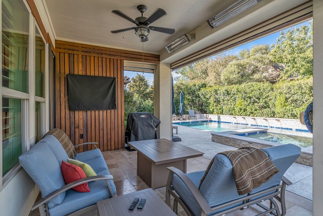 view of patio featuring a swimming pool with hot tub, area for grilling, ceiling fan, and outdoor lounge area