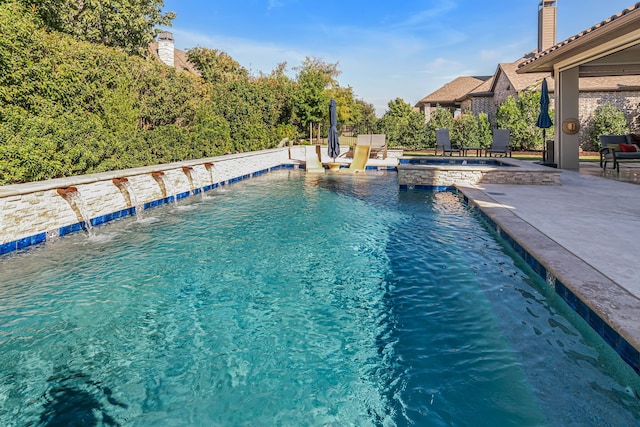 view of swimming pool with a patio and pool water feature