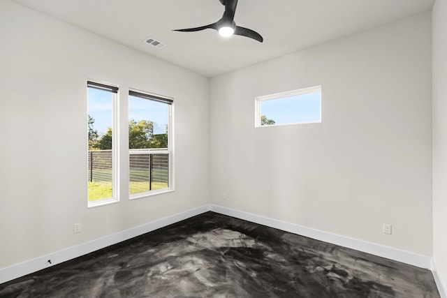 spare room with a wealth of natural light and ceiling fan