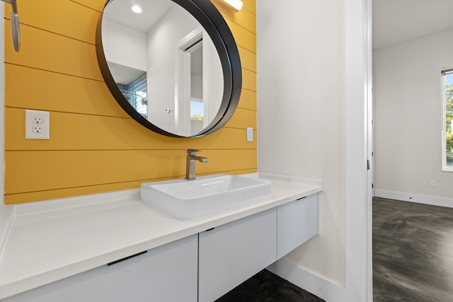 bathroom with vanity and concrete floors