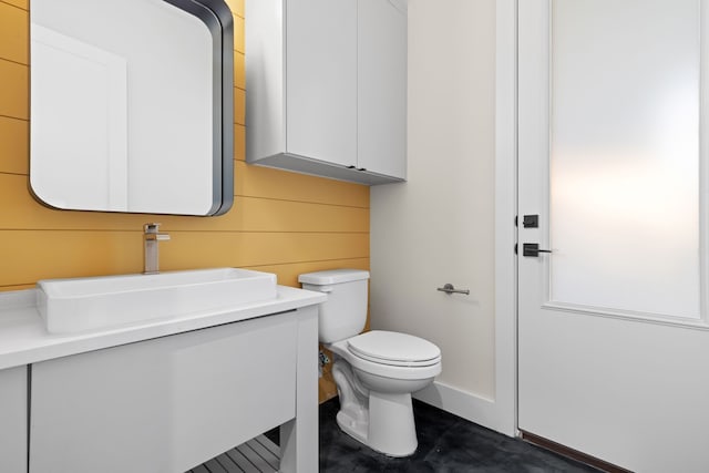 bathroom with toilet and vanity