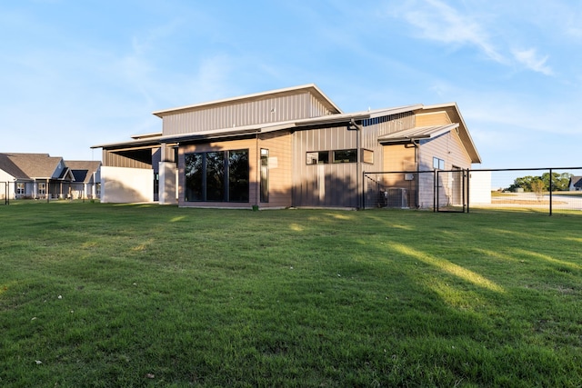 rear view of house with a lawn