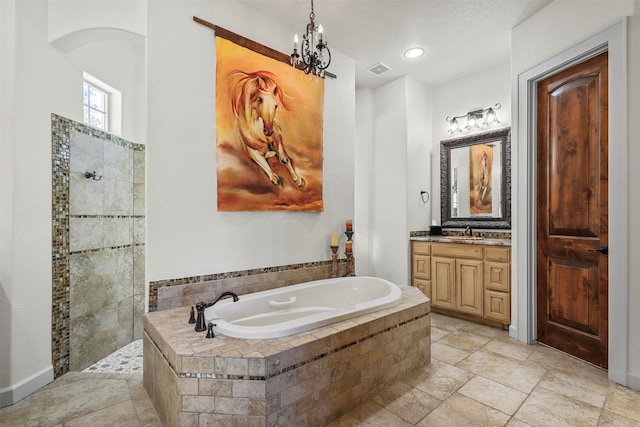 bathroom with shower with separate bathtub, vanity, and an inviting chandelier