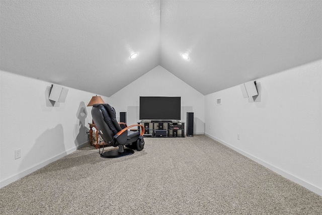 sitting room featuring carpet flooring, a textured ceiling, and vaulted ceiling