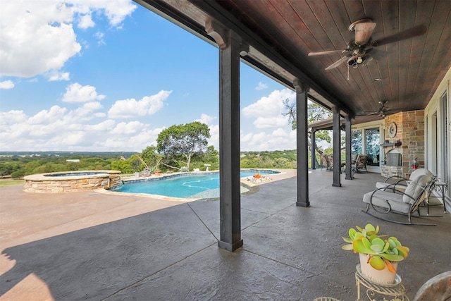 view of pool with ceiling fan, an in ground hot tub, and a patio area