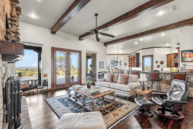 living room featuring dark hardwood / wood-style flooring, beamed ceiling, french doors, and ceiling fan with notable chandelier