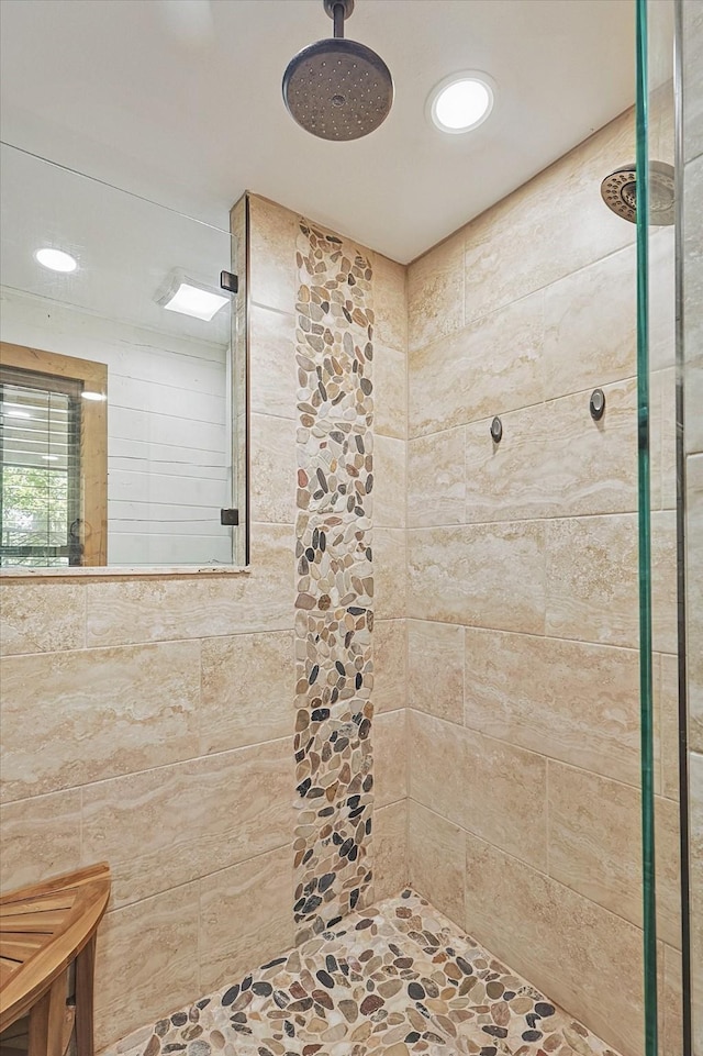 bathroom with a tile shower