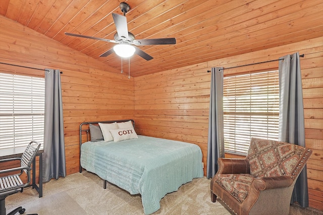 bedroom featuring lofted ceiling, light carpet, wooden walls, ceiling fan, and wood ceiling