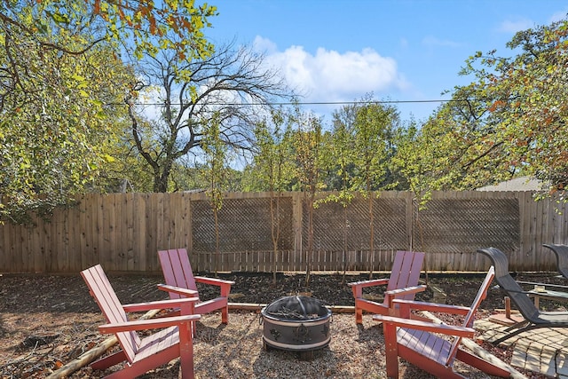 view of patio with an outdoor fire pit