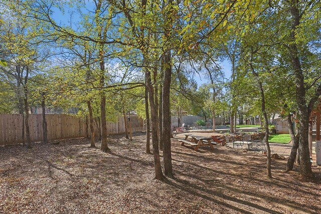 view of yard with central air condition unit and a patio